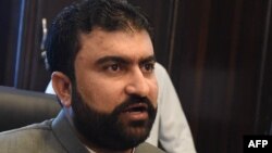 FILE - Sarfraz Bugti, then the Pakistan Baluchistan province home minister, addresses a media briefing in Quetta, Aug. 2, 2015.