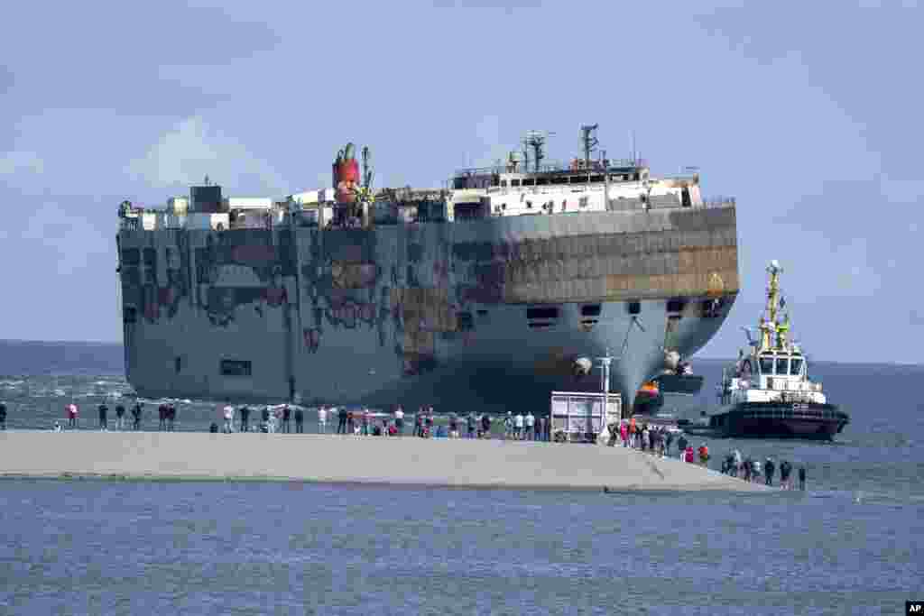 The cargo ship Fremantle Highway, which&nbsp;caught fire while transporting thousands of cars from Germany to Singapore, is towed into the port of Eemshaven, the Netherlands.&nbsp;The ship burned for almost a week close to busy North Sea shipping lanes and a huge migratory bird habitat. It will be taken to the northern Dutch port.&nbsp;