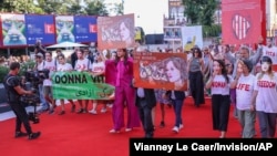 Supporters of Iran's women march at the Venice Film Festival in Venice, Italy, Sept. 2, 2023. This year's festival also saw the world premiere of 'Tatami,' a thriller co-directed by Iranian and Israeli filmmakers and shot in secret to prevent possible interference by Tehran.