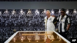 Fans visit the tomb of the late Brazilian soccer great Pele which became open to the public for the first time at the mausoleum of Necropole Ecumenica Memorial Cemetery in Santos, Brazil on Monday, May 15, 2023.