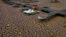 FILE - A pedal boat is tied to a dock in a dried part of the Sau reservoir, about 100 km (62 miles) north of Barcelona, Spain, April 18, 2023. 