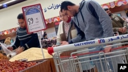 Egyptians buy groceries at a supermarket in Cairo, Feb. 26, 2023. 