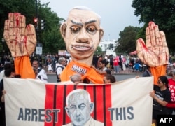 Pro-Palestinian demonstrators stand with an effigy of Israeli Prime Minister Benjamin Netanyahu protest near the White House to denounce U.S. President Joe Biden meeting's with Netanyahu in Washington, July 25, 2024.