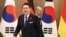 German Chancellor Olaf Scholz, rear, and South Korea's President Yoon Suk Yeol arrive for their meeting at the Presidential Office in Seoul, South Korea, May 21, 2023. Scholz arrived in Seoul after attending the G7 summit in Hiroshima, Japan.