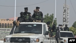 FILE - Chad police officers patrol the streets in N'Djamena on May 10, 2024, a day after the announcement of the results of Chad's presidential election.