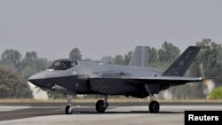 FILE - A U.S. Air Force F-35 fighter jet taxis at Yelahanka air base in Bengaluru, India, Feb. 13, 2023. The U.S. Air Force plans to upgrade more than 80 fighter jets stationed at Japanese bases over the next several years; the upgrade includes advanced F-35 jets.