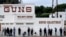 FILE – People wait to enter a gun store in Culver City, Calif., on March 15, 2020. 