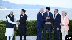 From left, India PM Modi, French President Macron, U.S. President Biden, Canada PM Trudeau, Australia PM Albanese and EU President von der Leyen in Hiroshima, Japan, May 20, 2023.