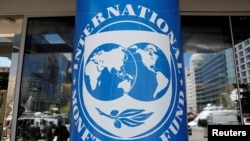 FILE: The International Monetary Fund's logo is seen outside the global lender's headquarters in Washington, U.S., April 20, 2018. 