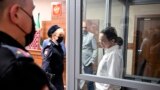 Alsu Kurmasheva, right, a journalist for U.S.-funded Radio Free Europe/Radio Liberty who was arrested last year for failing to register as a "foreign agent," attends a hearing on the extension of her pre-trial detention, at a court in Kazan, Russia, April 1, 2024. 