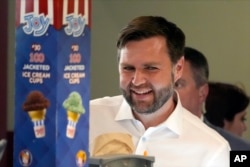 Republican vice presidential candidate Senator JD Vance (R-Ohio) orders ice cream from Olson's Ice Cream in Eau Claire, Wisconsin on August 7, 2024.