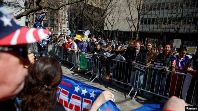 Anti-Trump protesters face Trump supporters outside the Manhattan Criminal Courthouse in New York, April 4, 2023.