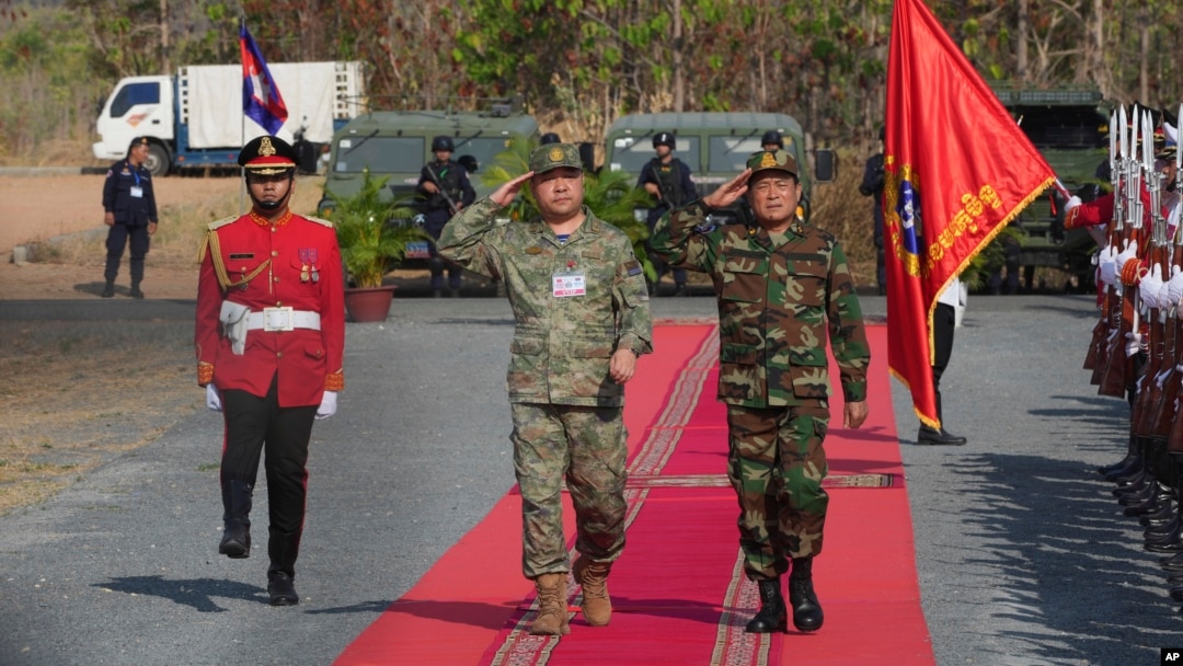 Commanders of the Chinese People's Liberation Army and the Cambodian army review troops as they arrive for the Golden Dragon military exercises in Svay Chok village, Kampong Chhnang province, north of Phnom Penh, Cambodia, May 16, 2024.