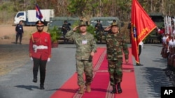 Commanders of the Chinese People's Liberation Army and the Cambodian army review troops as they arrive for the Golden Dragon military exercises in Svay Chok village, Kampong Chhnang province, north of Phnom Penh, Cambodia, May 16, 2024.