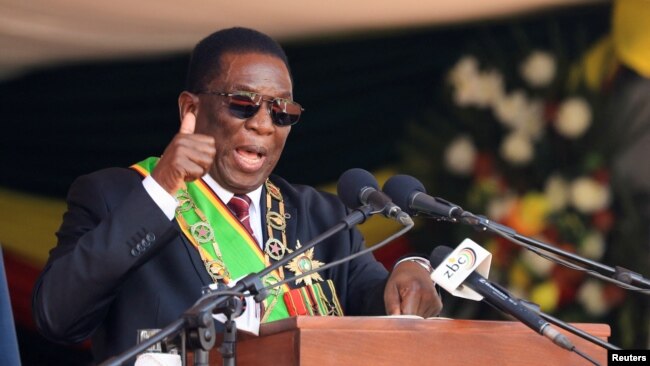 FILE - Zimbabwe President Emmerson Mnangagwa speaks during his inauguration at the National Sports Stadium in Harare, Sept. 4, 2023. In his new year message Mnangagwa has predicted the country's economy will turn around this year following the recent discovery of oil and gas.