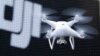 FILE - A Phantom 4, developed by Chinese consumer drone maker DJI, is pictured during a demonstration flight in Tokyo, March 3, 2016.