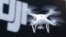 FILE - A Phantom 4, developed by Chinese consumer drone maker DJI, is pictured during a demonstration flight in Tokyo, March 3, 2016.