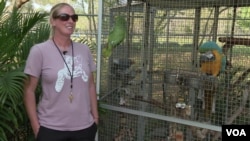 Kylie Reynolds with parrots