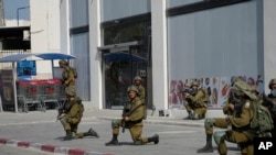 Israeli soldiers deploy in Sderot, Israel, on Oct. 7, 2023.