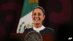 President-elect Claudia Sheinbaum smiles during a press conference at the National Palace in Mexico City, June 10, 2024.