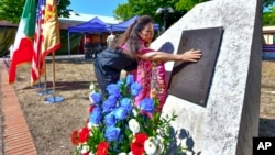 Valerie Matsunaga, whose father fought in the 442nd Infantry Regiment during World War II, attends a commemoration at the U.S. military base of Camp Darby, Tuscany, central Italy, July 11, 2024.