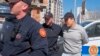 Montenegrin police officers escort an individual who is believed to be fugitive Terraform Labs founder Do Kwon, a South Korean citizen, in Montenegro's capital Podgorica, March 24, 2023.