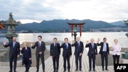 Leaders of G7 nations and European Commission President Ursula von der Leyen pose for a photo during a visit to the Itsukushima Shrine in Miyajima Island as part of the G7 Leaders' Summit in Japan, May 19, 2023.