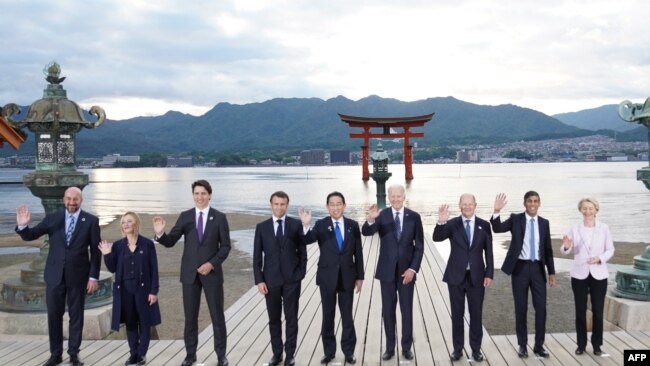 Leaders of G7 nations and European Commission President Ursula von der Leyen pose for a photo during a visit to the Itsukushima Shrine in Miyajima Island as part of the G7 Leaders' Summit in Japan, May 19, 2023.
