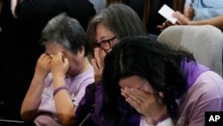 Bereaved family members of the victims of the Halloween crush in 2022 react at the National Assembly in Seoul, South Korea, May 2, 2024. 
