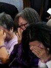 Bereaved family members of the victims of the Halloween crush in 2022 react at the National Assembly in Seoul, South Korea, May 2, 2024. 