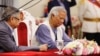 Nobel laureate Muhammad Yunus signs the oath book as the country’s head of the interim government in Bangladesh at the Bangabhaban, in Dhaka, Bangladesh, Aug. 8, 2024.