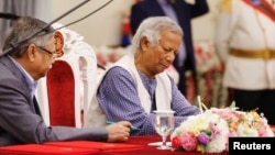 Nobel laureate Muhammad Yunus signs the oath book as the country’s head of the interim government in Bangladesh at the Bangabhaban, in Dhaka, Bangladesh, Aug. 8, 2024.