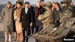British Prime Minister Rishi Sunak joins other political leaders to view military equipment that has been given to Ukraine before they attend the Joint Expeditionary Summit on the Baltic island of Gotland, Sweden. (Stefan Rousseau/Pool via Reuters)