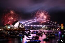 Fireworks explode over Sydney Harbour as New Year's Eve celebrations get underway in Sydney, Dec. 31, 2023. (Dan Himbrechts/AAP Image via AP)