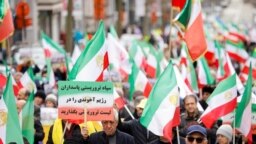 Supporters of the National Council of Resistance of Iran (NCRI) take part in a protest, in Brussels, Belgium, March 20, 2023. European ministers agreed to add eight Iranians and one of the Tehran government's most powerful bodies to EU sanctions lists.