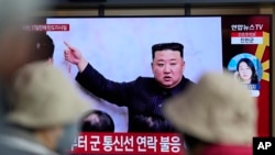 FILE - A TV screen is seen reporting North Korea's missile launch with a file image of North Korean leader Kim Jong Un during a news program at the Seoul Railway Station in Seoul, South Korea, April 13, 2023. 