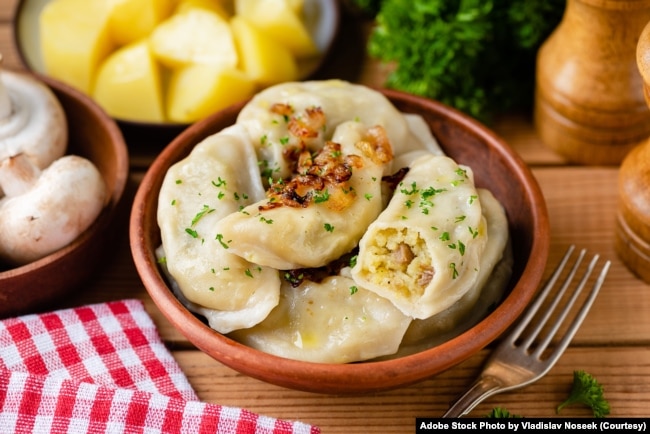 FILE- Potato mushroom stuffed vareniky, pierogi or dumplings. (Adobe Stock Photo by Vladislav Noseek)