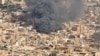 A screen grab shows black smoke and fire at Omdurman market in Omdurman, Sudan, May 15, 2023. Omdurman neighbors Sudan's capital, Khartoum. (Handout via Reuters)