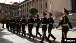 Soldiers march in a ceremony for the Belt and Road Forum, which marked the 10th anniversary of the Belt and Road Initiative, at the Great Hall of the People in Beijing, China, Oct. 18, 2023.