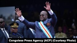 In this photo by the Congolese Press Agency, ACP, President Felix Tshisekedi is seen waving to a large crowd at his inauguration ceremony at the Stade de Martyrs, or Martyrs Stadium in Kinshasa, DR Congo on January 20, 2024.