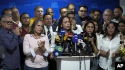 Opposition leader Maria Corina Machado holds a press conference over arrest warrants for her campaign manager and eight staffers for alleged involvement in a conspiracy plot to destabilize the government, in Caracas, Venezuela, March 20, 2024.