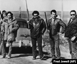 Oglala Lakota chairman Dick Wilson (R) and members of his private militia at a roadblock set up to prevent supplies from reaching Wounded Knee occupiers.