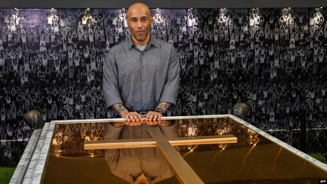 The son of late Brazilian football star Pele, Edson Cholbi Nascimento, poses for a picture while visiting the mausoleum where his father's coffin rests, at the Ecumenical Necropolis Memorial cemetery in Santos, Brazil on May 15, 2023. 
