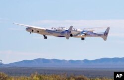 Virgin Galactic's mothership Eve, carrying the rocket-powered plane Unity 22, takes off from Spaceport America, near Truth or Consequences, New Mexico, Aug. 10, 2023.