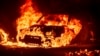 Flames consume a vehicle as the Park Fire burns in Tehama County, Calif., on July 26, 2024. 