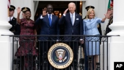 (FILE) President Joe Biden salutes and first lady Jill Biden, Kenya's President William Ruto and Kenya's first lady Rachel Ruto, at the White House in Washington, Thursday, May 23, 2024.