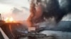 На фотографии, предоставленной Telegram-каналом премьер-министра Украины Дениса Шмыгаля, дым и огонь поднимаются над Днепровской ГЭС после российских атак. 22 марта 2024 года.