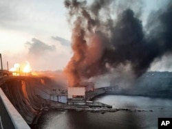 In this photo provided by Telegram Channel of Ukraine's Prime Minister Denys Shmyhal, smoke and fire rise over the Dnipro hydroelectric power plant after Russian attacks in Dnipro, Ukraine, March 22, 2024.