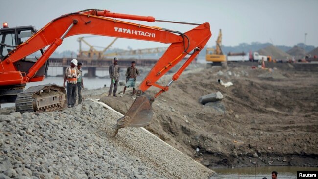 FILE - Construction of new port at the Kaladan River in Sittwe, Myanmar, May 19, 2012.