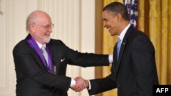US President Barack Obama presents the 2009 National Medal of Arts to John Williams during a ceremony Feb. 25, 2010 in Washington, DC.